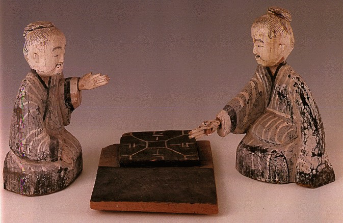甘肅武威磨咀子48號西漢墓出土彩繪木雕對弈六博俑